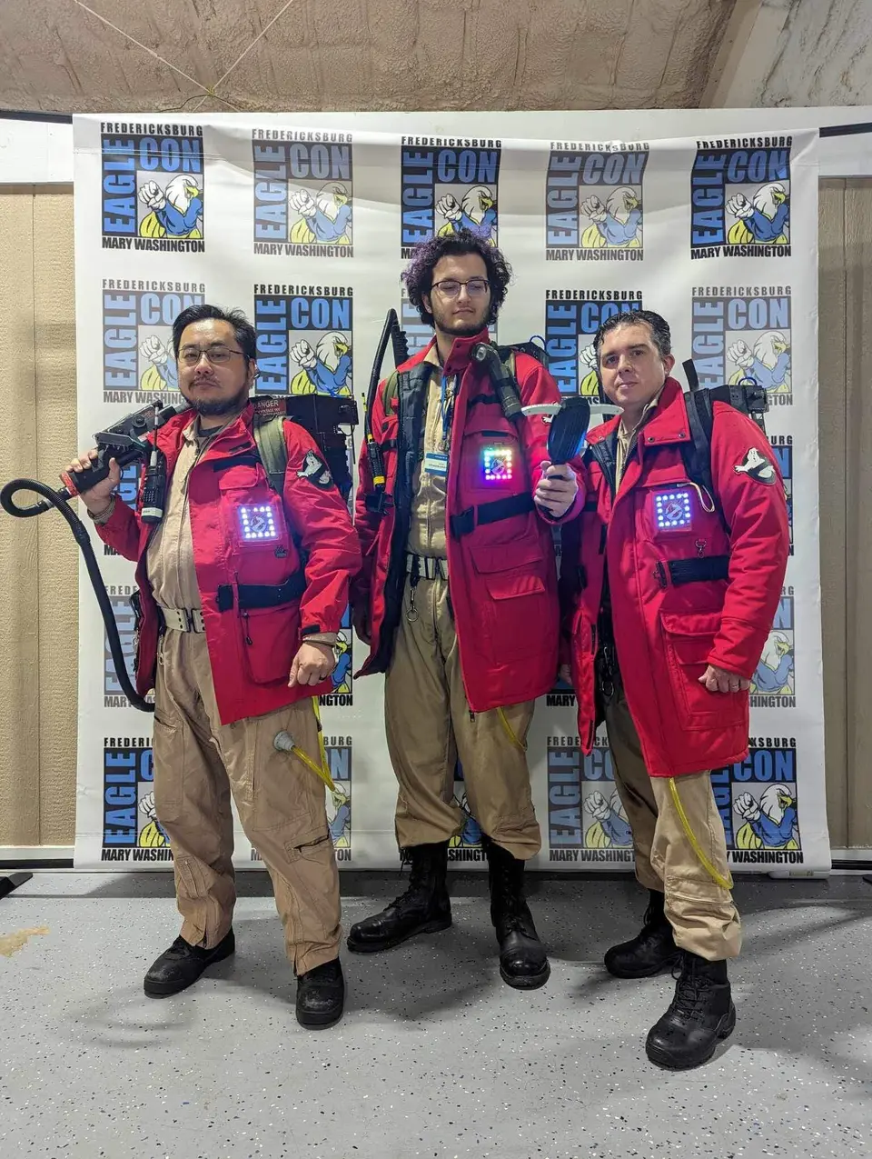Ghostbusters Virginia members at their convention booth with Slimer prop and merchandise display