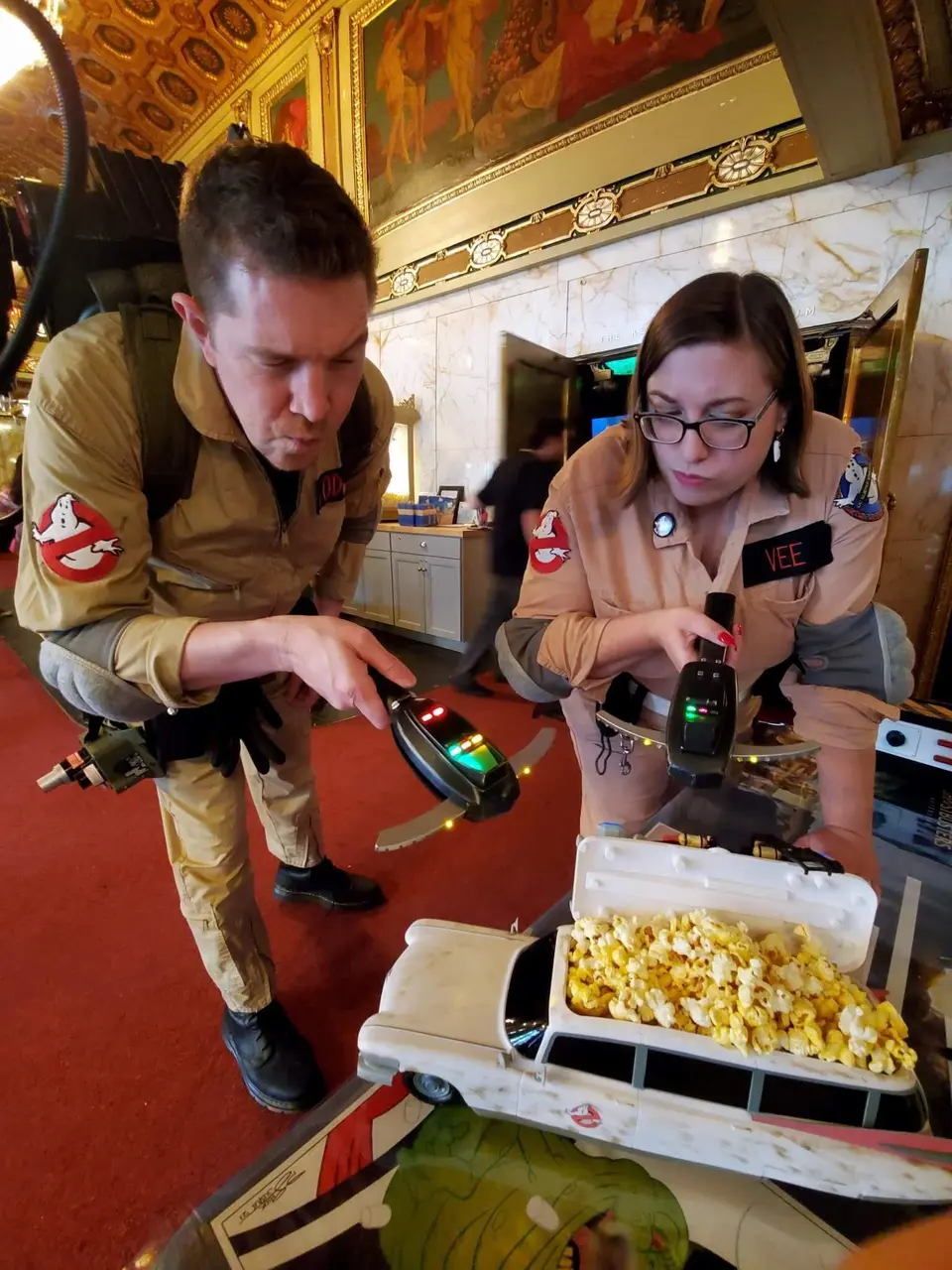 Close-up of a Ghostbusters Virginia member operating a PKE meter prop with glowing lights