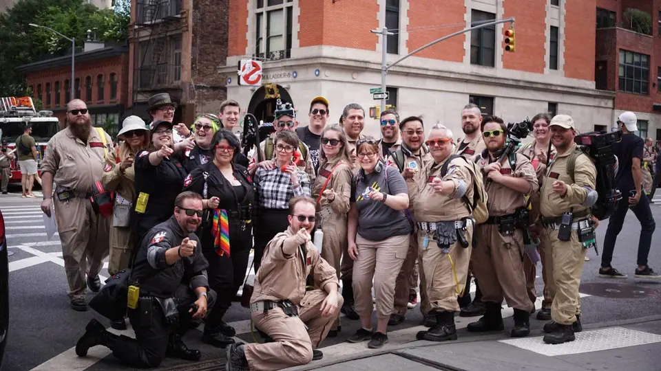Large group of Ghostbusters Virginia members posing together on a city street